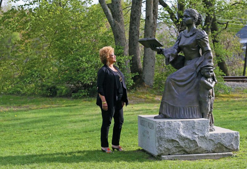 JerriAnne Boggis, executive director of the Black Heritage Trail of New Hampshire, at the memorial to Harriet E. Wilson of Milford, the first African-American woman to publish a novel in the United States. (Photo by Cheryl Senter.)